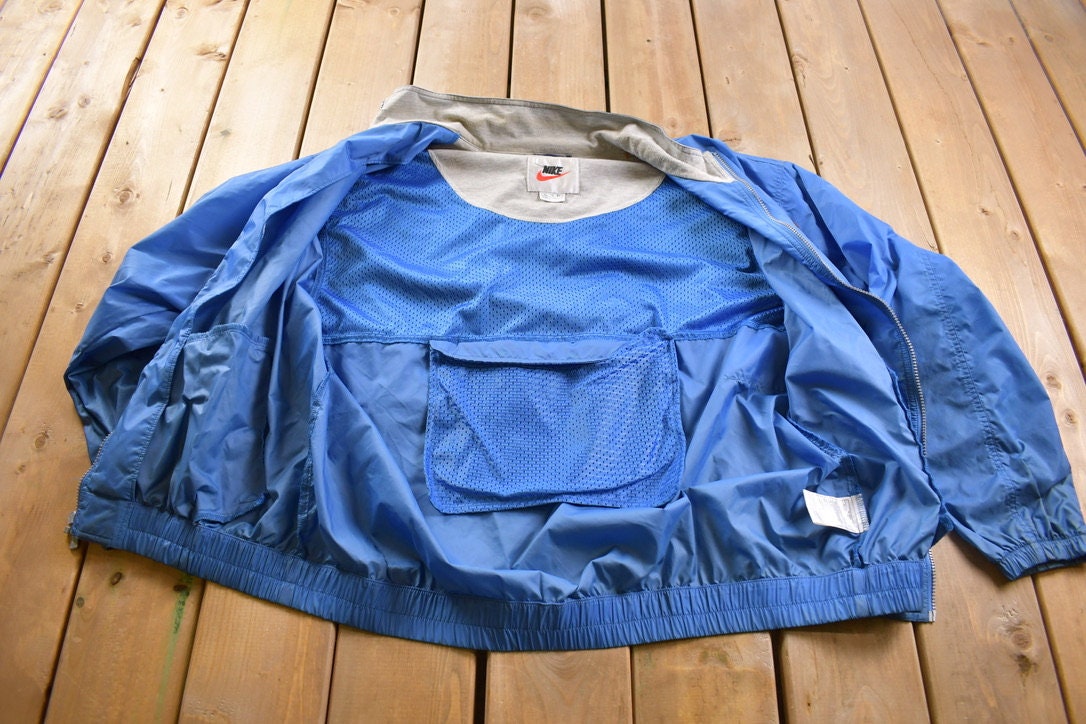 Vintage 1990s Nike Embroidered Mini Swoosh Windbreaker Jacket