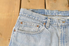Vintage 1990s Levi's Distressed 550 Relaxed Fit Denim Jeans Men's 33 x 33 / 90s Levi's / Blown Out Sun Faded Jeans