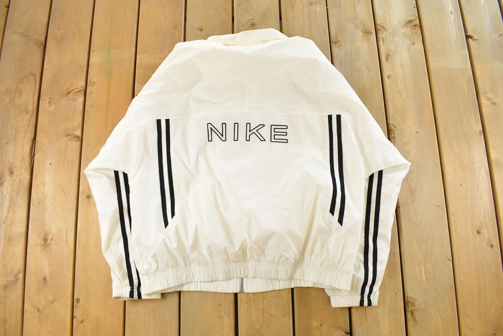 Vintage 1990s Nike Mini Swoosh Windbreaker Jacket Men's Large