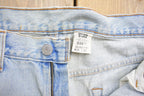 Vintage 1990s Levi's 550 Red Tab Ripped Denim Jeans Size 32 x 31