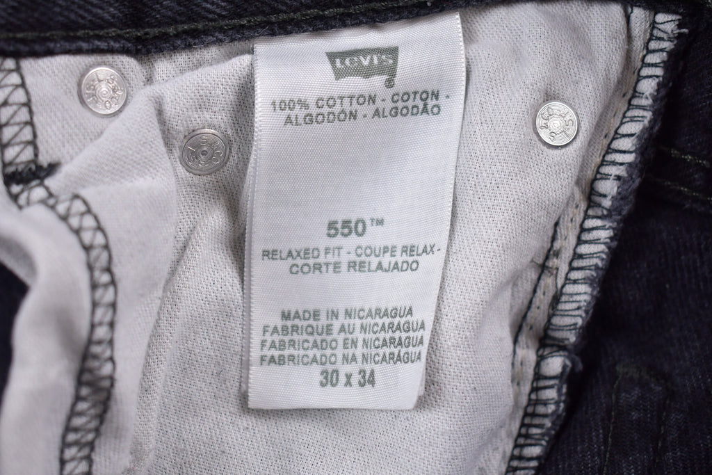 Vintage 1990s Levi's Distressed 550 Red Tab Jeans Size 30 x 32