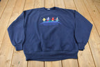 Vintage 1990s Peace On Earth Embroidered Crewneck Sweatshirt Made In USA
