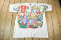 Vintage 1990s Tiny Tunes Destination Alps All Over Print Graphic T-Shirt  Warner Bros  Looney Tunes  3XL  CUT NECK