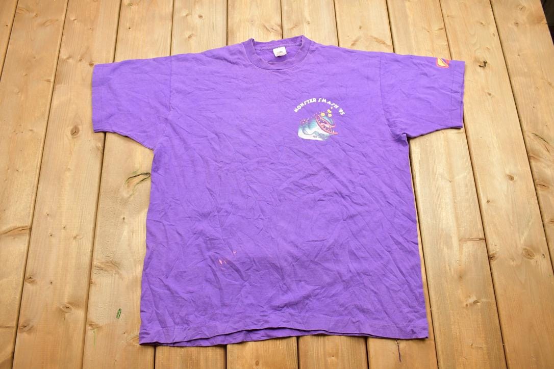 Vintage 1990s Fruit of The Loom Monster Smash '95 Travel T Shirt Made In USA Single Stitch
