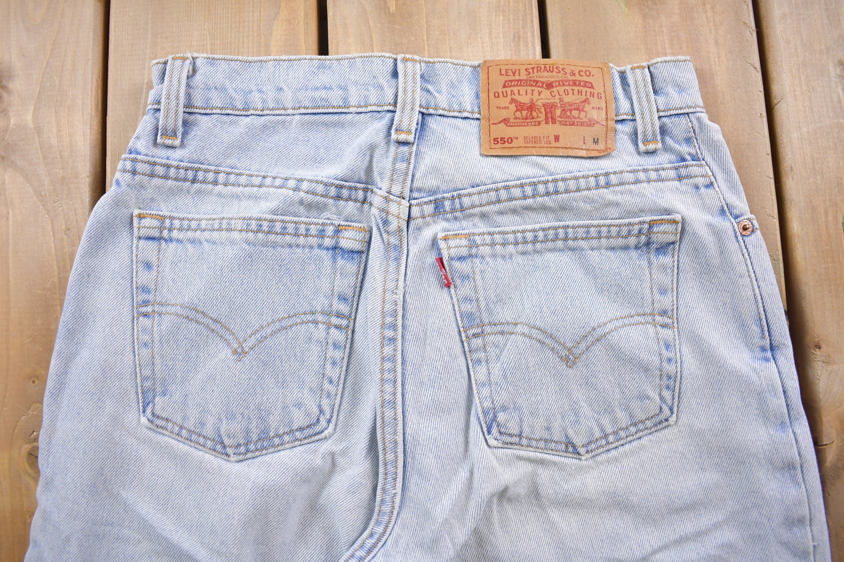 Vintage 1990s Levi's 550 Red Tab Jeans Size 26 x 30