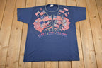 Vintage 1990s Stars And Stripes Wrap Around Patriotic American Flag Print T Shirts