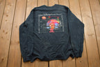 Vintage 1990s Planet Hollywood Graphic T-Shirt