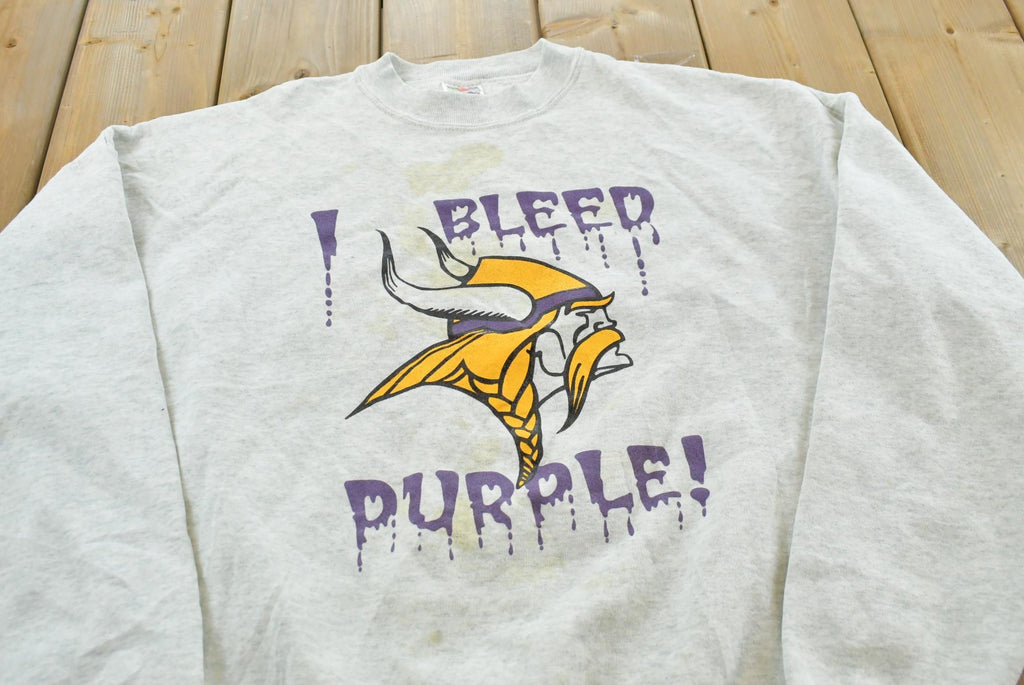 Vintage 1990s Minnesota Vikings I Bleed Purple NFL Crewneck Sweatshirt Mens M / 90's Americana Football Sportswear / Fruit of the Loom