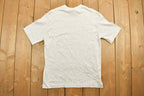 Vintage 1990s Roots Canada Graphic T-Shirt