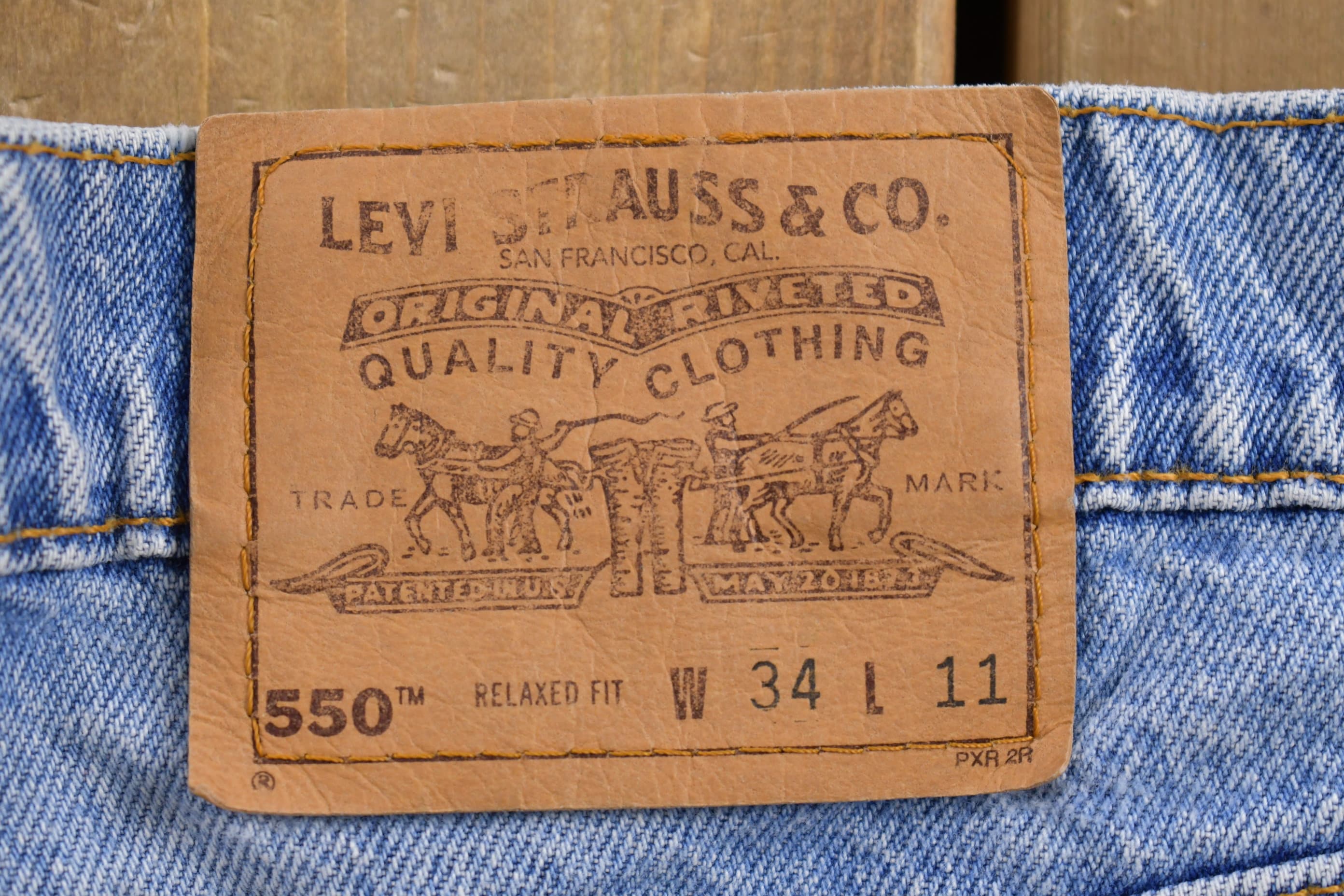 Vintage 1990s Levi's 550 Orange Tab Denim Shorts Size 31 x 6.5