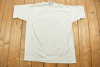 Vintage 1990s Ogilvy Renault Law Firm Graphic T-Shirt