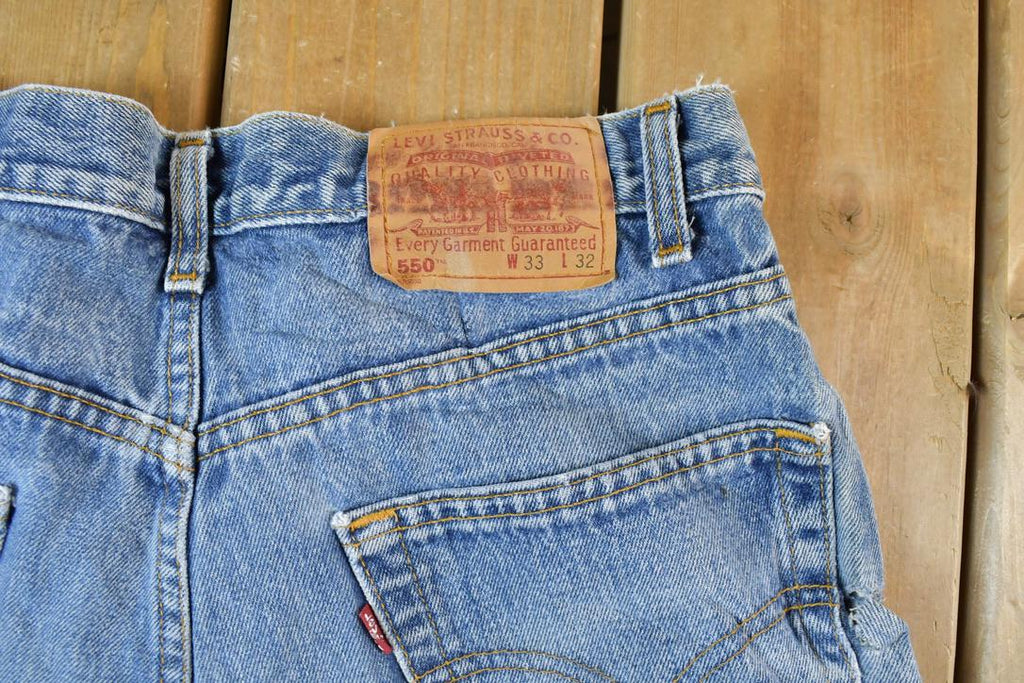 Vintage 1990s Levi Strauss Distressed Red Tab 550 Denim Jeans Size 33 x 32