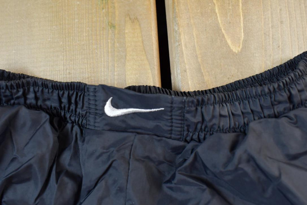 Vintage 1990s Nike Mini Swoosh Splash Pants Size M
