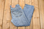 Vintage 1990s Distressed Levi's 550 Light Wash Jeans