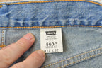 Vintage 1990s Levi's 560 Loose Fit Denim Blue Jeans Size 30 x 32 / 90s Levi's / Distressed Sun Faded Jeans / Made in USA / Streetwear