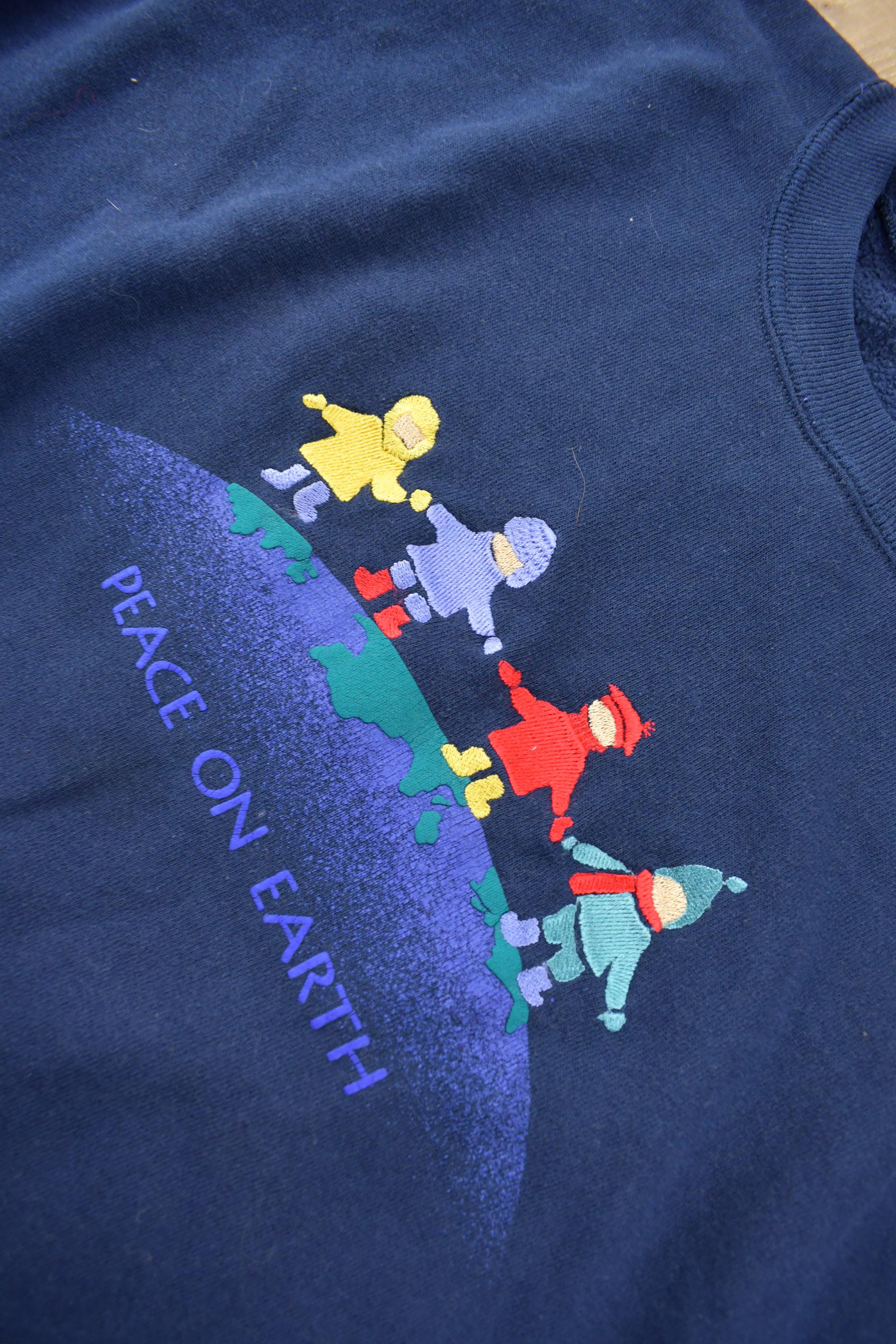 Vintage 1990s Peace On Earth Embroidered Crewneck Sweatshirt Made In USA