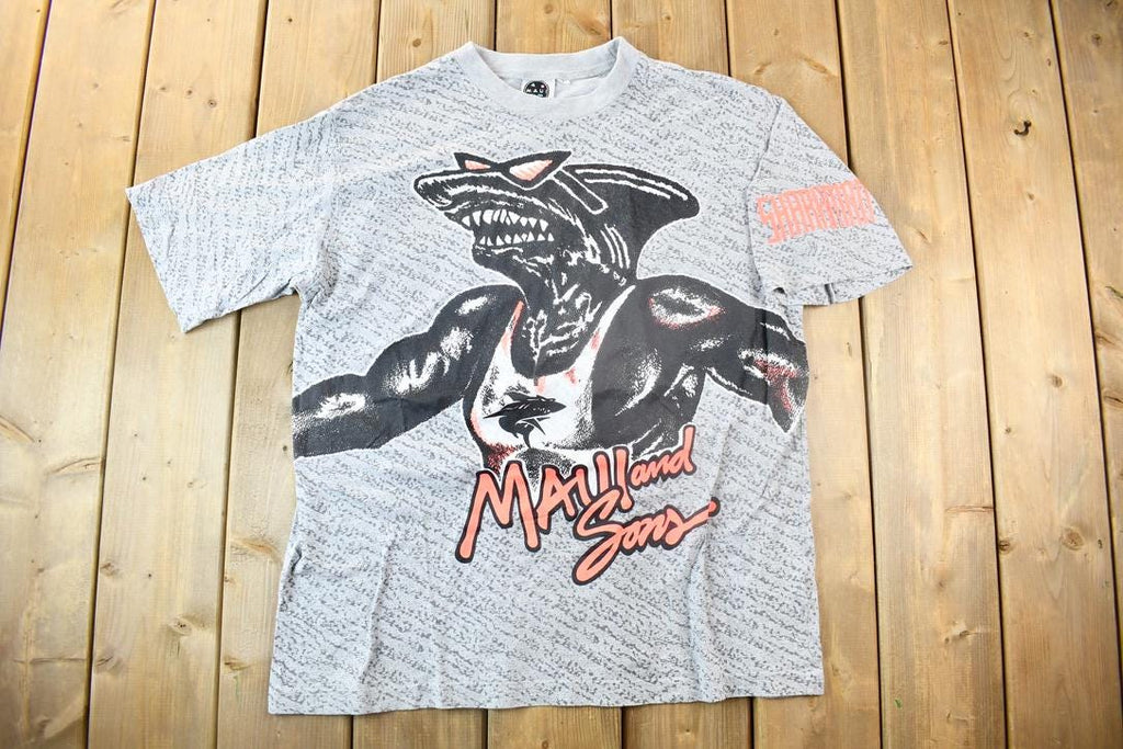 Vintage 1990s Maui And Sons Sharkman All Over Print Graphic T Shirt