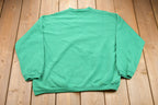 Vintage 1990s Official Christmas Kisser Graphic Crewneck Sweatshirt / 90s Crewneck / Souvenir / Athleisure /Holiday Sweatshirt / Made In USA