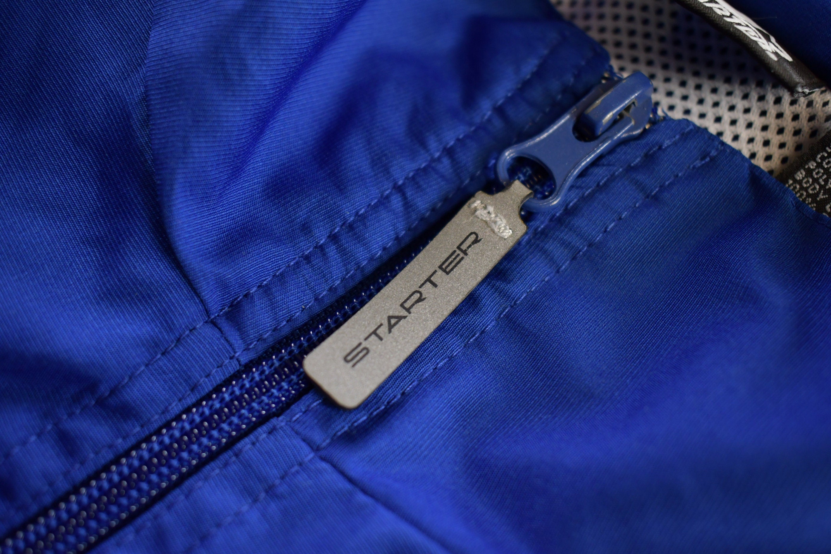 Vintage 1990s Starter Embroidered Windbreaker Jacket