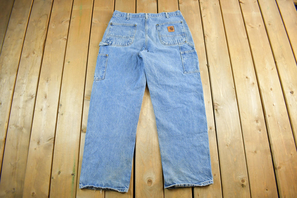 Vintage 1990s Carhartt Distressed Double Knee Denim Work Jeans Adult 34 x 30