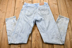Vintage 1990s Perfectly Distressed Levi's 550 Light Wash Jeans