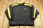 Vintage 1990s Pittsburgh Steelers NFL Logo Athletic Puffer Jacket