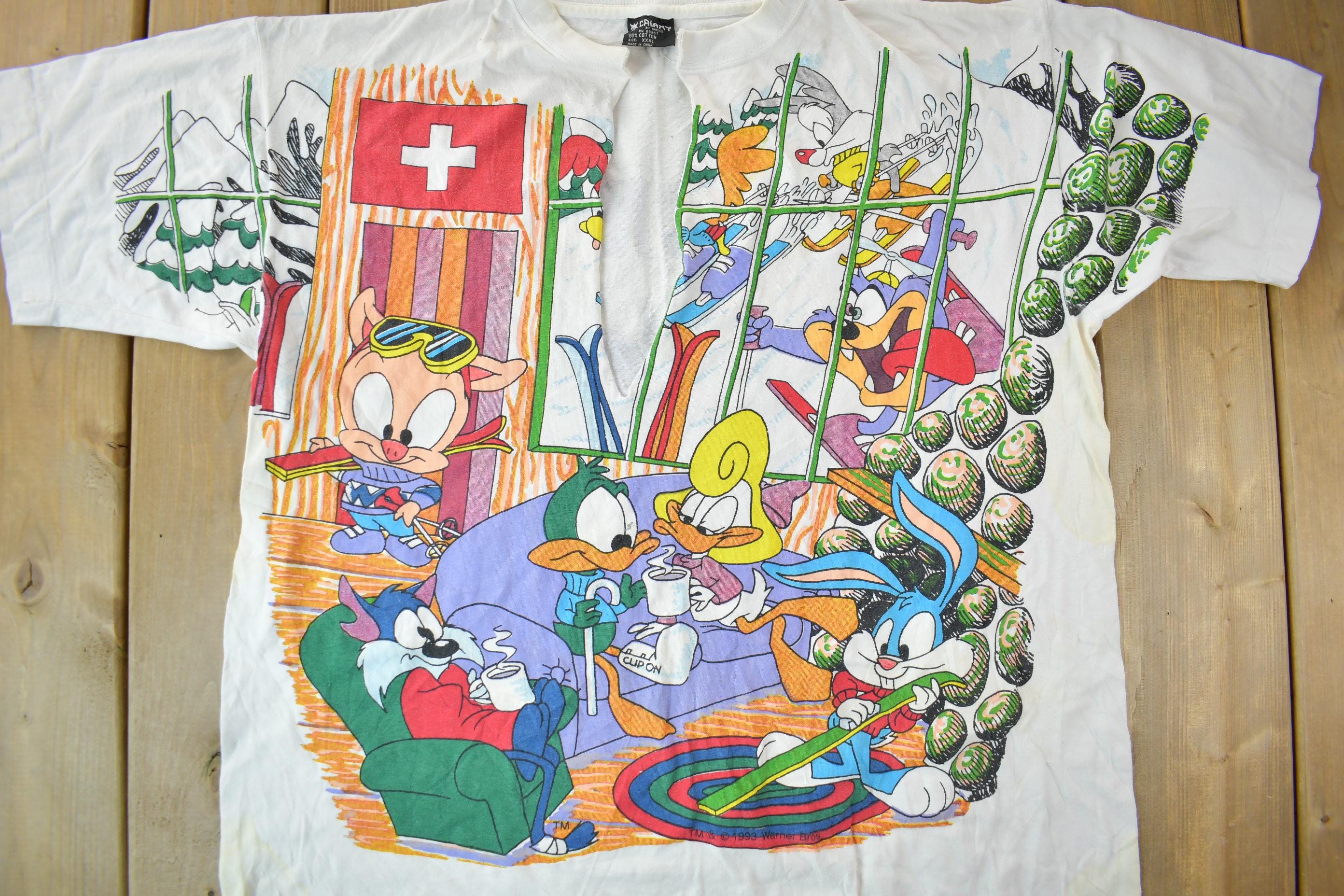 Vintage 1990s Tiny Tunes Destination Alps All Over Print Graphic T-Shirt  Warner Bros  Looney Tunes  3XL  CUT NECK