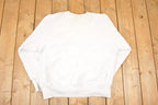 Vintage 1990s Camp Knutson Cross Grain Graphic Print Crewneck Sweatshirt Mens L