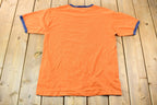 Vintage 2005 Dracula Night of the Vampire Orange and Blue Ringer Graphic T-Shirt
