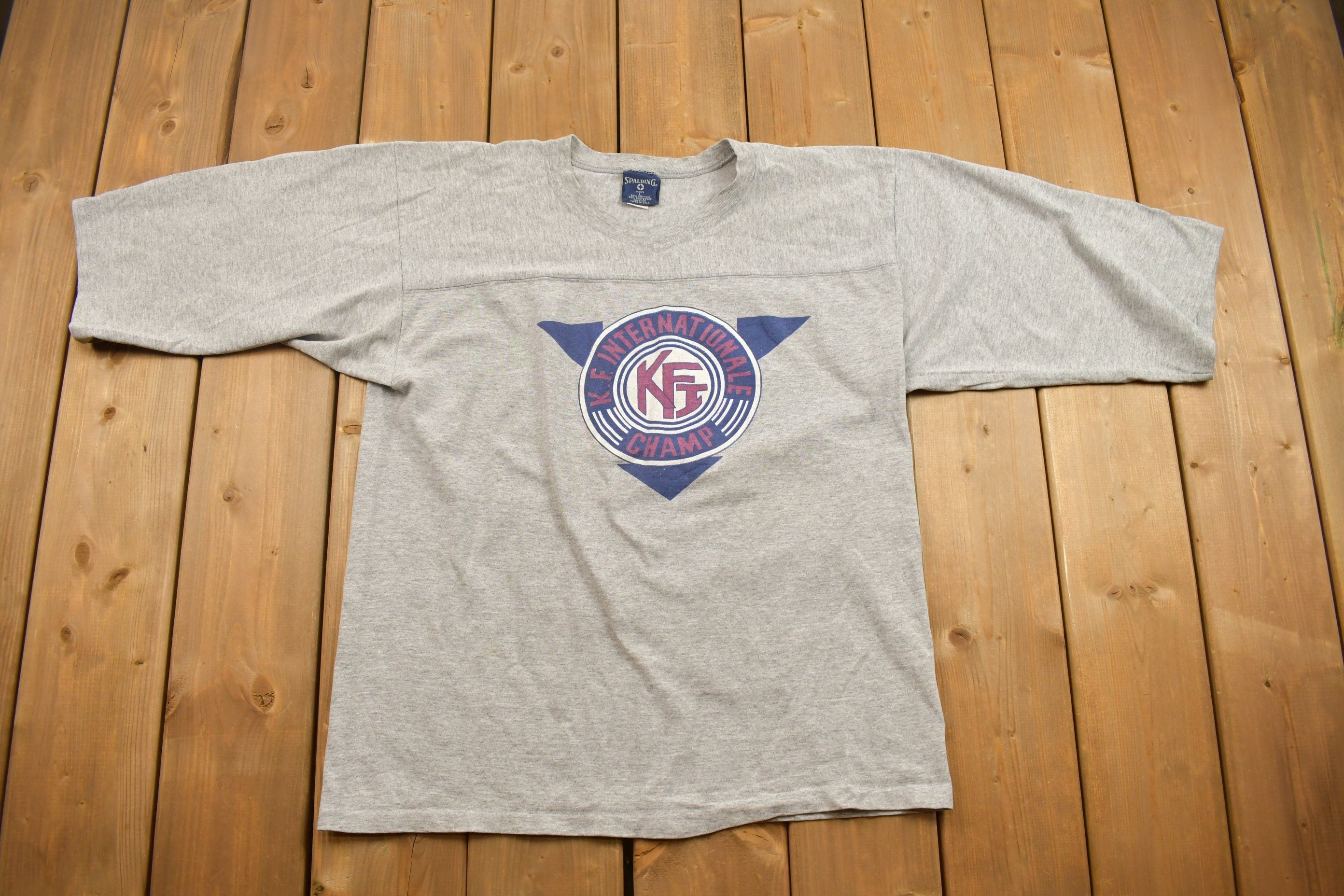 Vintage 1990s K.F Internationale Champ Graphic T Shirt
