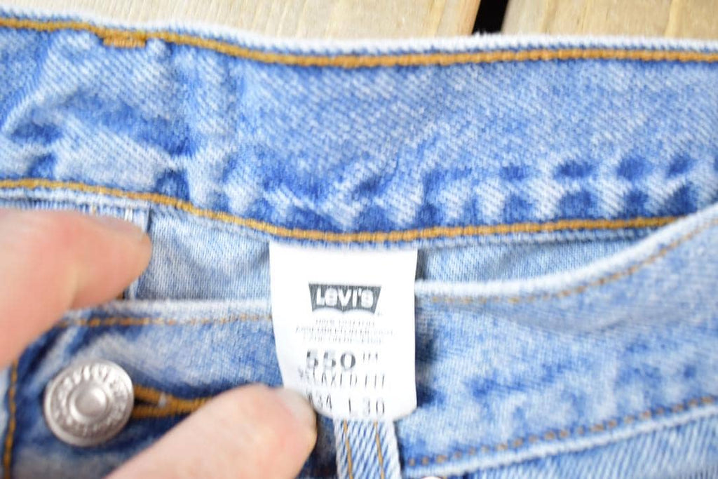 Vintage 1990s Levi Strauss Red Tab 550 Denim Jeans Size 34 x 30 Made In USA