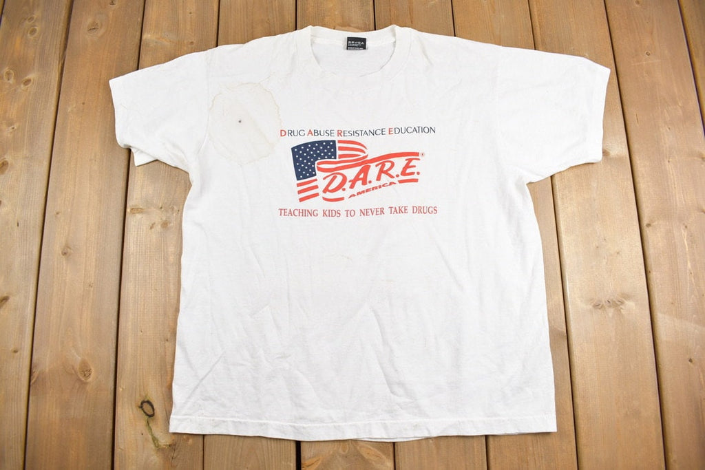Vintage 1990s DARE America Teaching Kids To Never Take Drugs Graphic T-Shirt