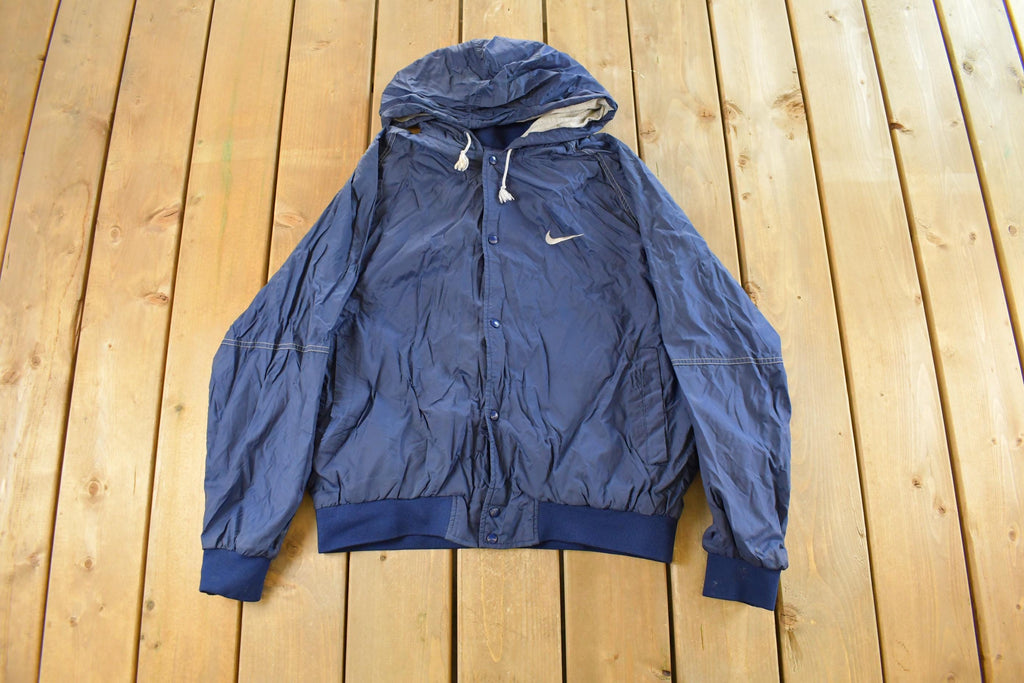 Vintage 1990s Nike Mini Swoosh Hooded Windbreaker Jacket Men's Large