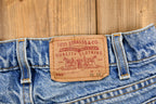 Vintage 1990s Distressed Levi's 550 Light Wash Jeans