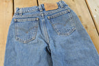 Vintage 1990s Levi's 550 Regular Fit Denim Blue Jeans Size 22 x 24.5 / 90s Levi's / Distressed Sun Faded Jeans / Streetwear