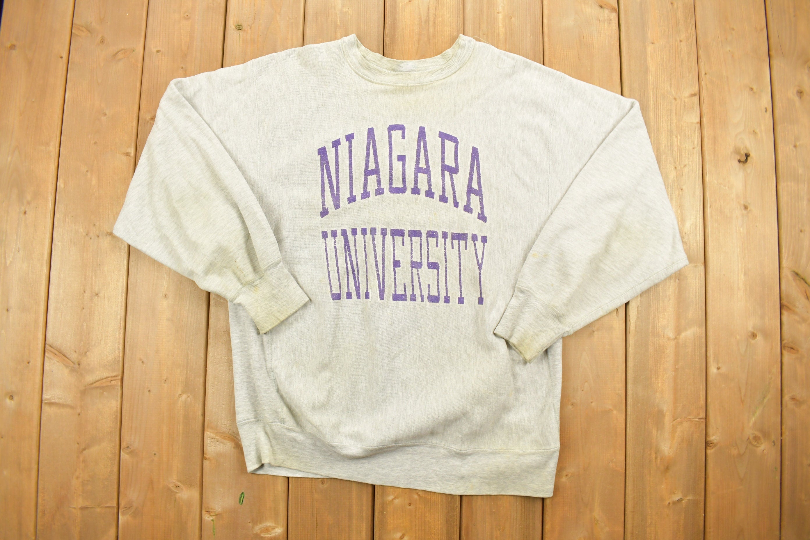 Vintage 1980's Champion Reverse Weave Warm-up Collegiate Crewneck University of Niagara Heavily Distressed.