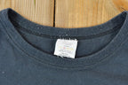 Vintage 1990s Goodyear Souvenir Take Me Home T-Shirt