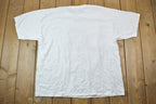 Vintage 1990s Pittsburgh Penguins Lets Go Pens NHL Graphic T-Shirt