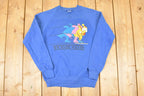 Vintage 1980s Jerzees Boundary Waters Speed Skating Cartoon Graphic Print Crewneck Sweatshirt Men's S