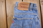 Vintage 1990s Levi's 550 Red Tab Jeans Size 26 x 33