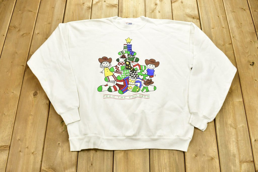 Vintage 1990s "Feed The Children" Graphic Christmas Sweater , 90s Holiday Crewneck , Winter Wear , Festive Graphic Print