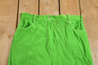 Vintage 1970s Neon Green Flared Trousers Size 32 x 29