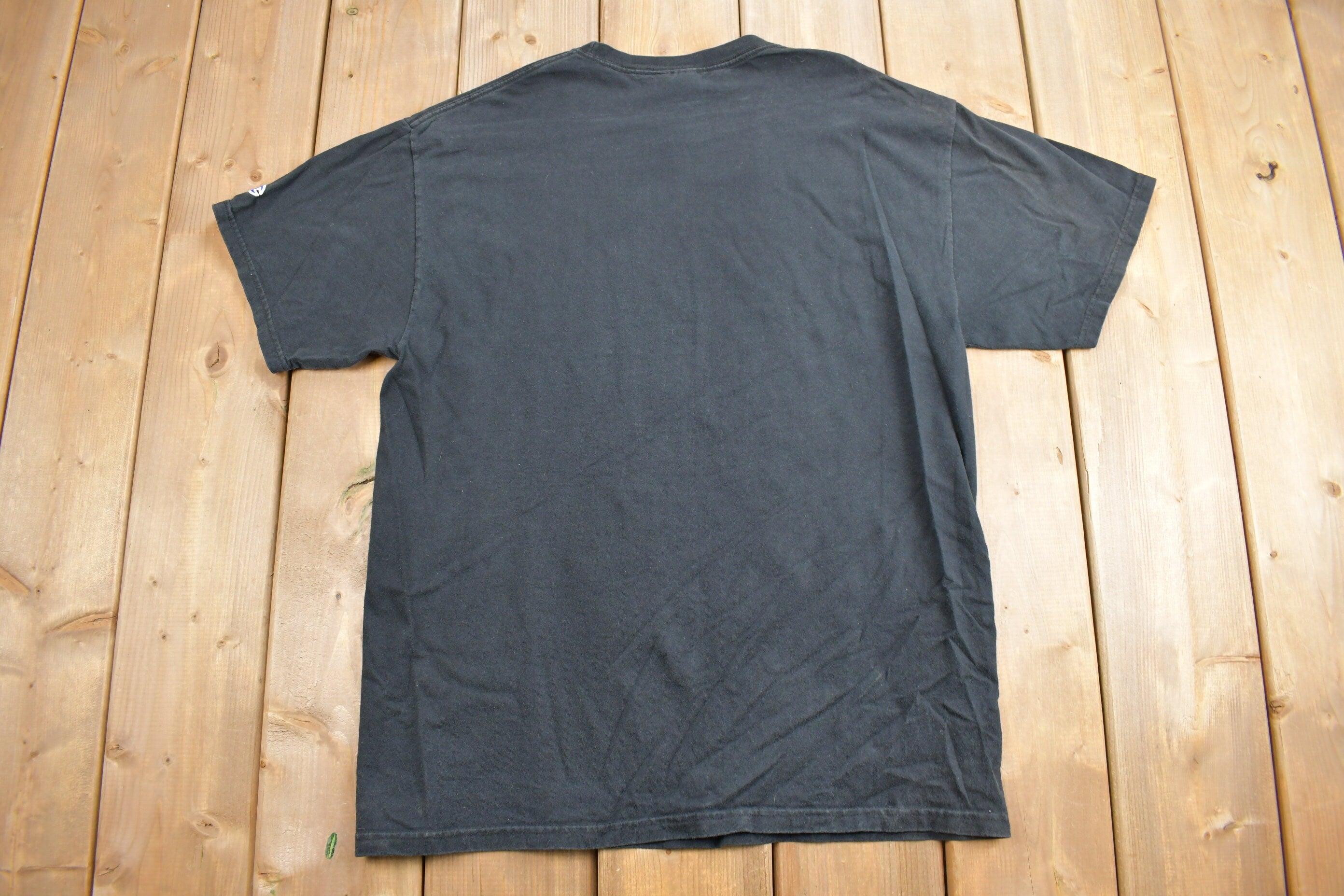 Vintage 1990s Champion Athletics Graphic T Shirt