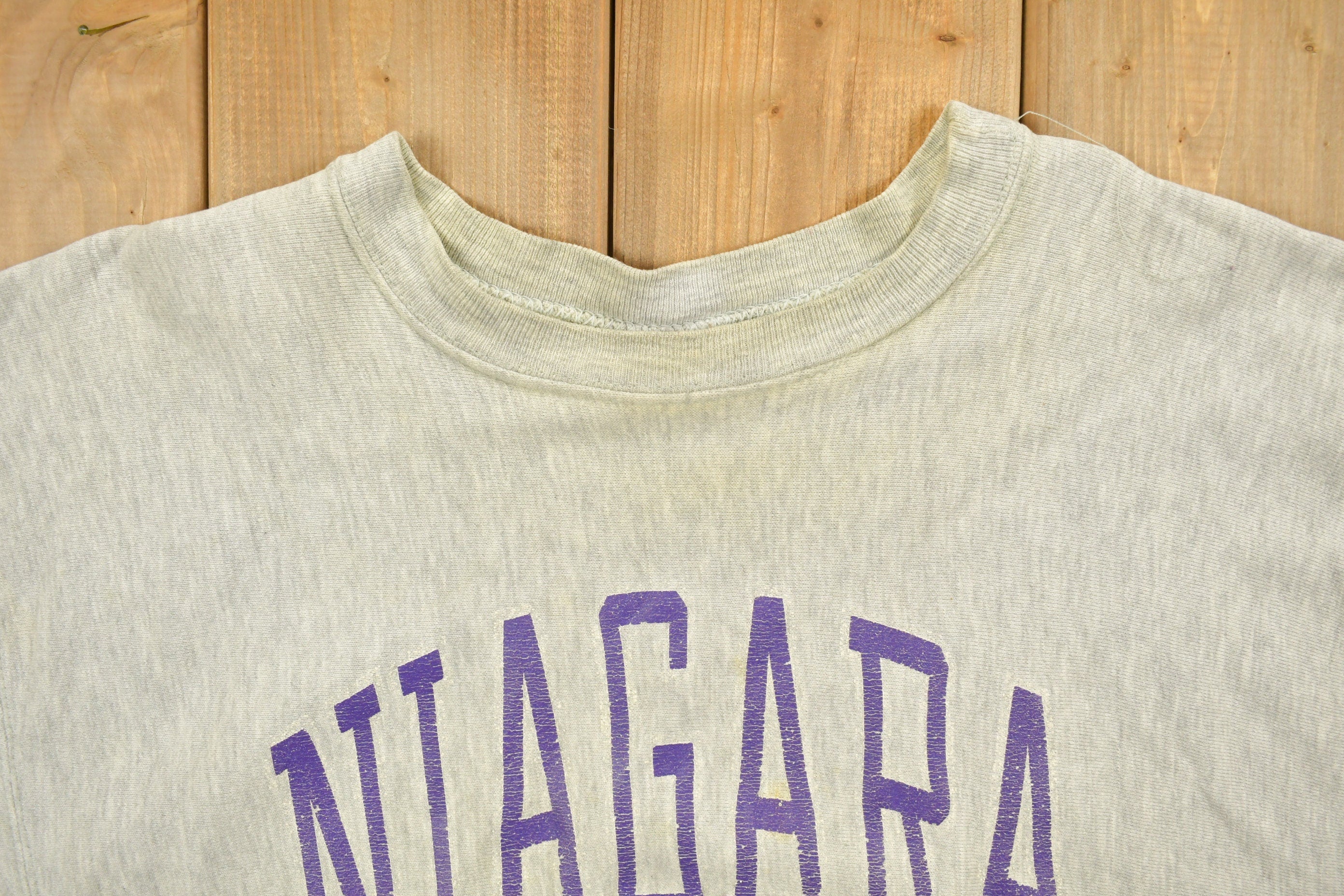 Vintage 1980's Champion Reverse Weave Warm-up Collegiate Crewneck University of Niagara Heavily Distressed.