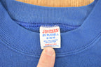 Vintage 1980s Jerzees Boundary Waters Speed Skating Cartoon Graphic Print Crewneck Sweatshirt Men's S