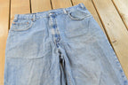 Vintage 1990s Levi's 560 Loose Fit Denim Blue Jeans Size 35 x 30 / 90s Levi's / Distressed Sun Faded Jeans / Streetwear