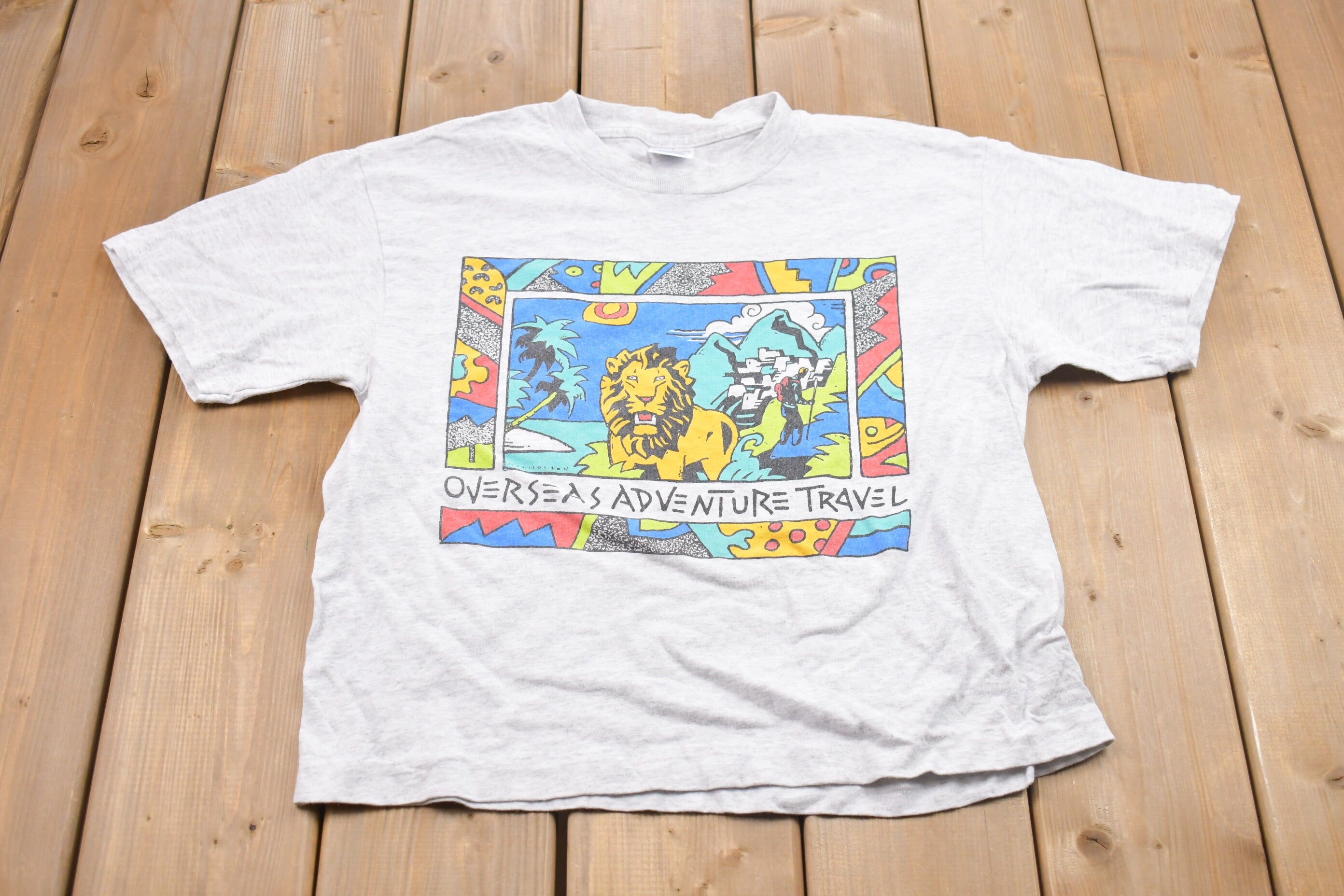 Vintage 1990s Overseas Adventure Travel Graphic T-Shirt