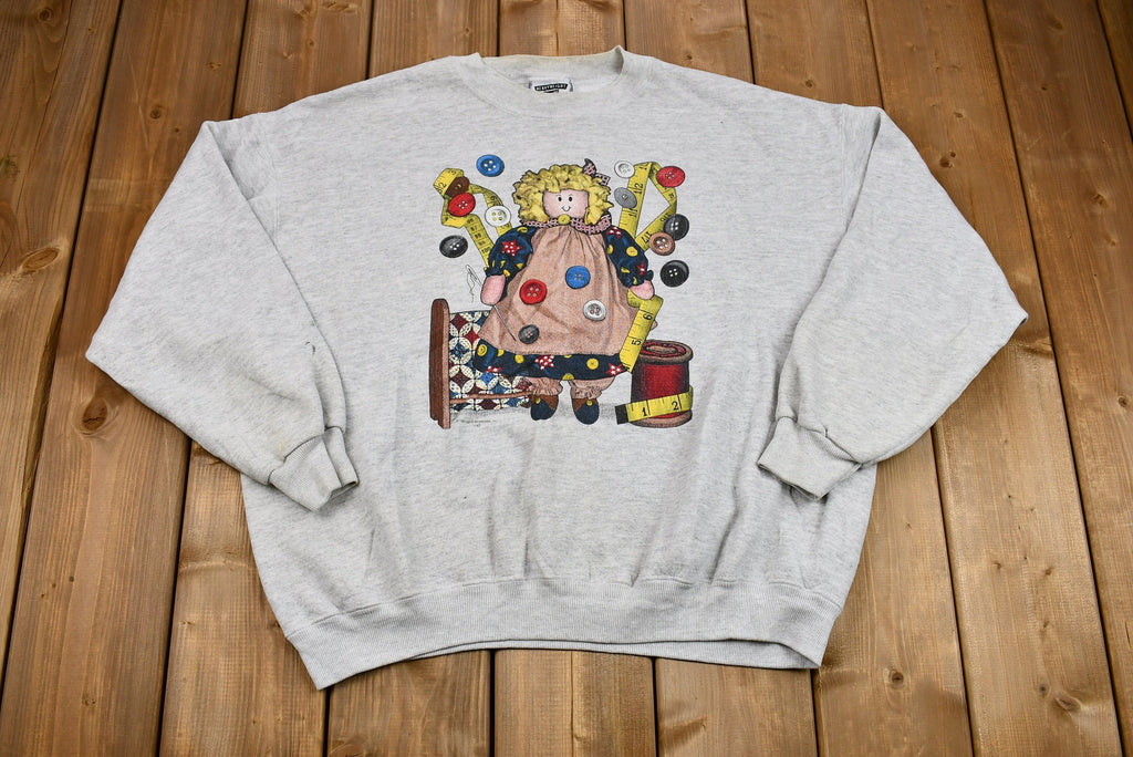 Vintage 1990s Seamstress Doll Graphic Crewneck Sweatshirt