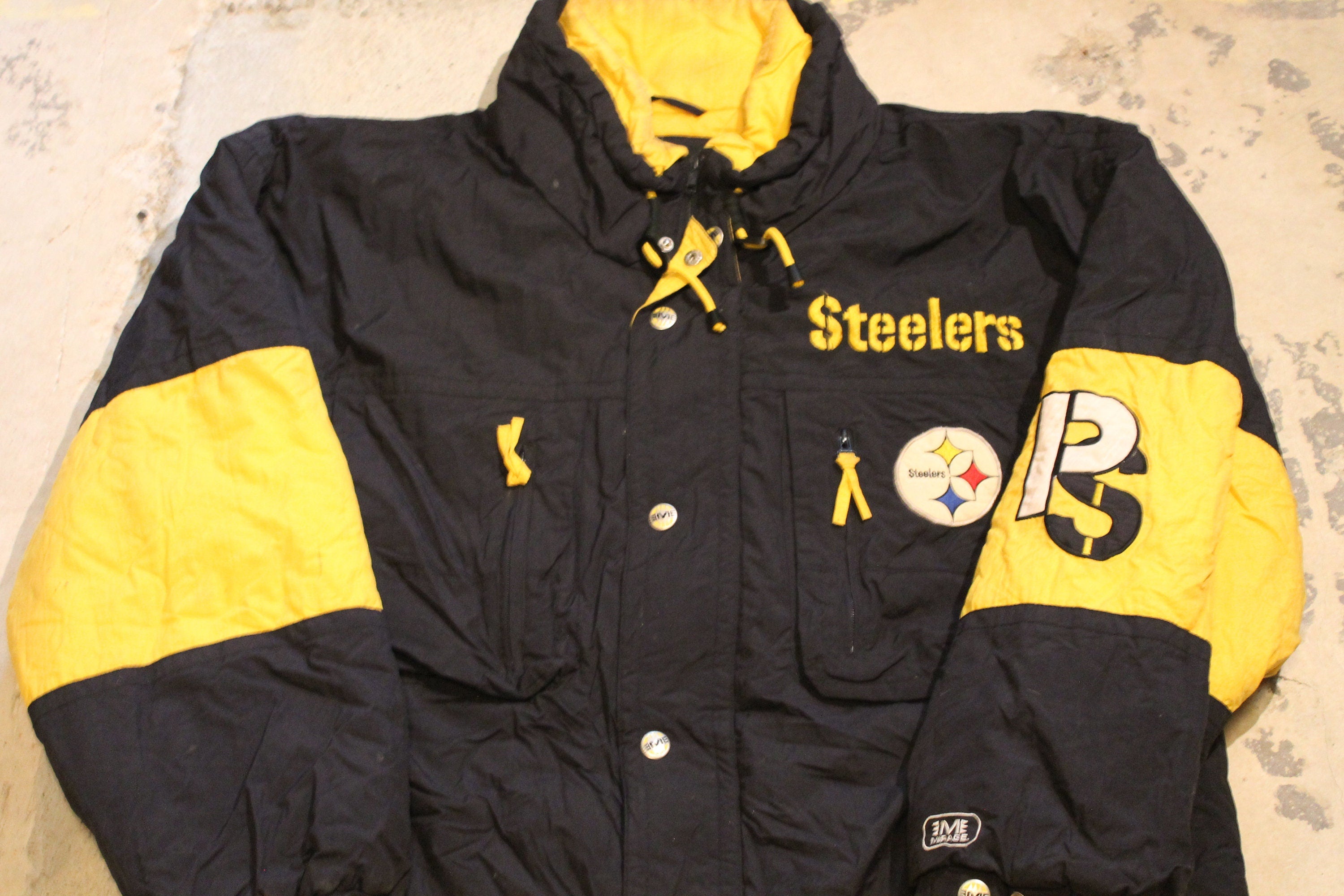 Vintage 1990s Pittsburgh Steelers NFL Mirage Full Zip Puffer Jacket