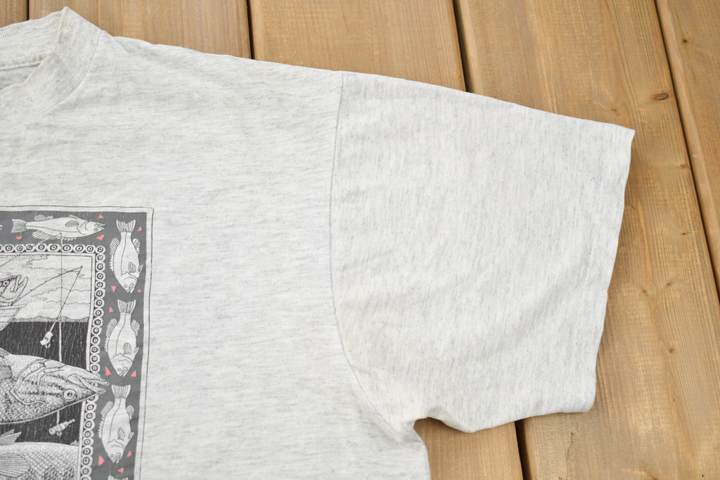 Vintage 1988 Bass Ackwards Fish Ray Troll Graphic T-Shirt